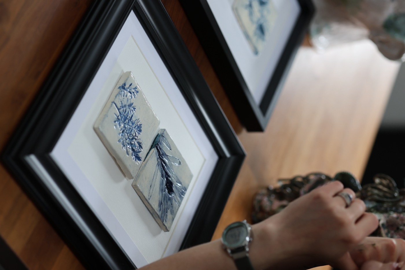 Strand Tiles, Framed Pair I — Porcelain relief, cobalt · framed, by Kirsi Salo